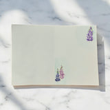 Hand-painted greeting card featuring dreamy lilac and blush tones with a watercolor sky, capturing soft, layered hues in a 5x7-inch original artwork