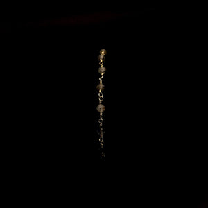 Image of 5, 14k yellow gold plated bracelets in front of a black background. From left to right the bracelets are made of freshwater pearl, turquoise, labradorite, strawberry quart and clear crystal