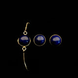 Image of lapis lazuli bracelet and matching stud earrings on a black background.