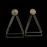 Image of faceted grey earrings with two, thin gold plated, overlapping triangles underneath, on a black background.