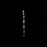 Image of a 14k yellow gold, chain bracelet with freshwater pearl beads.