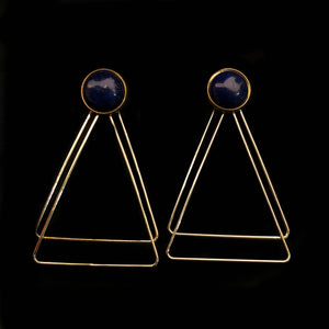 Image of lapiz lazuli earrings with two, thin gold plated, overlapping triangles underneath, on a black background.